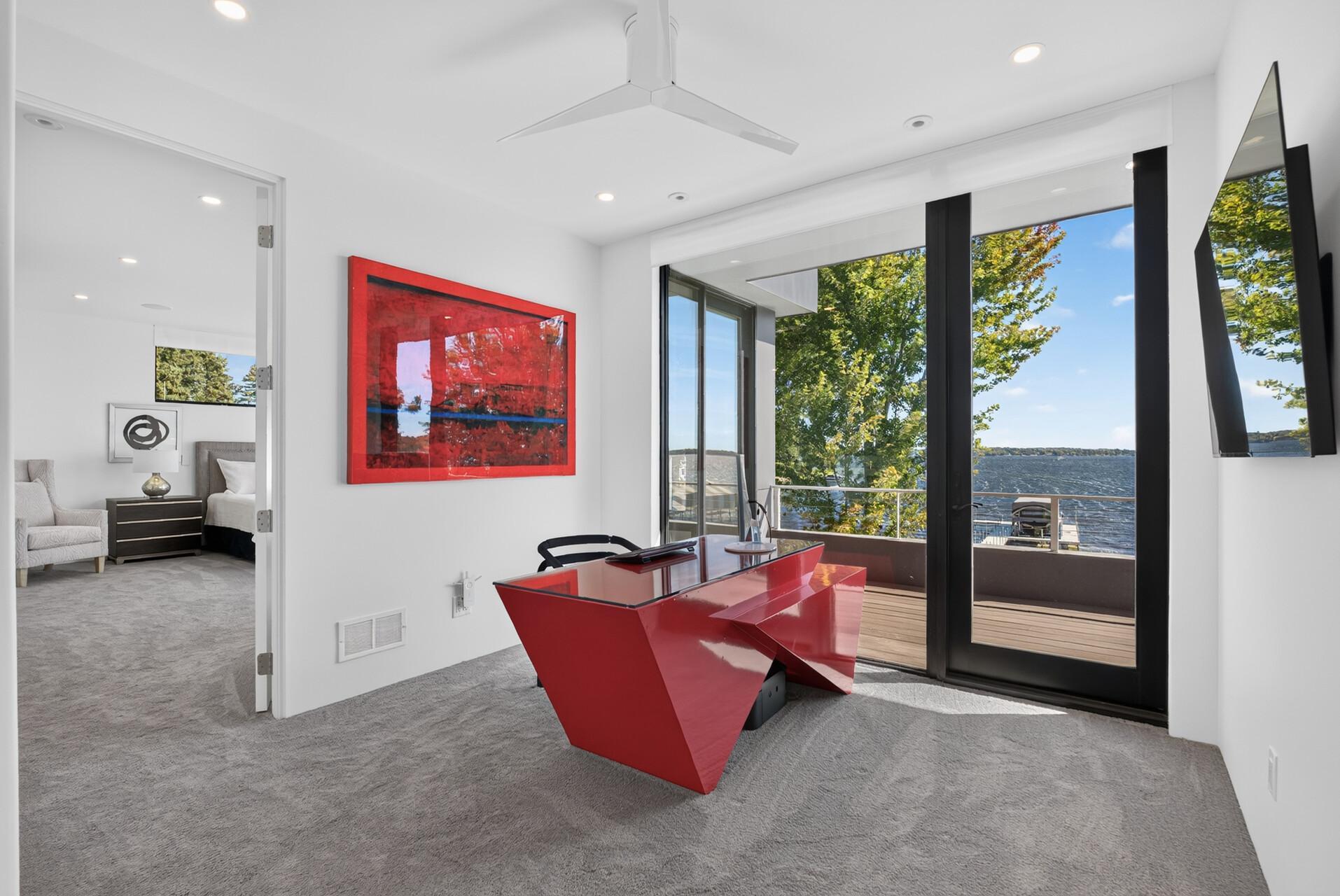 The upper level also offers a versatile office with beautiful lake views.