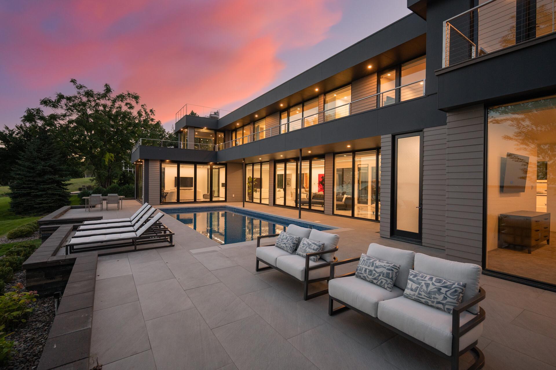 Sleek architectural finishes, extensive custom organization, and expansive windows.