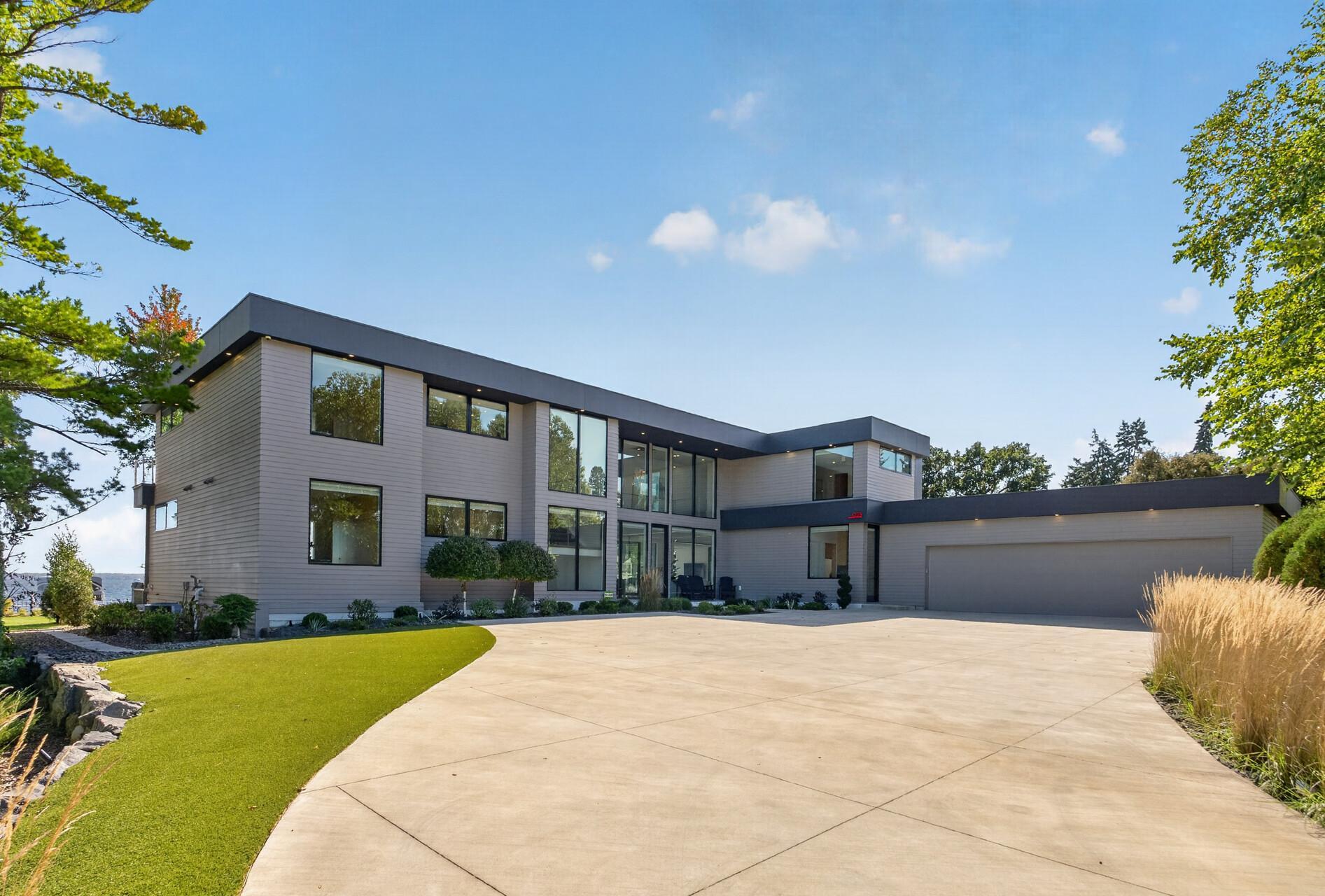 A home designed around luxury lake living, seamless indoor-outdoor connection, and an exceptional level of finish throughout.