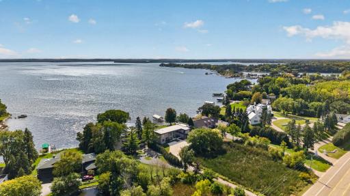 The level, over-an-acre setting sits back from the road, offering exceptional privacy, generous outdoor space, and direct access to Browns Bay.