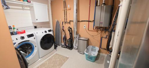 Completely finished laundry room with mechanicals
