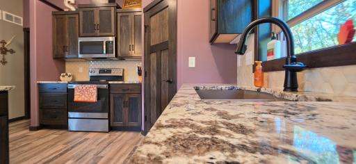 Granite tops throughout kitchen with excellent patterns!
