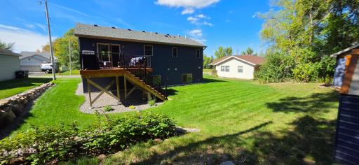 Large deck with quiet and peaceful backyard. Raspberry bushes as well!
