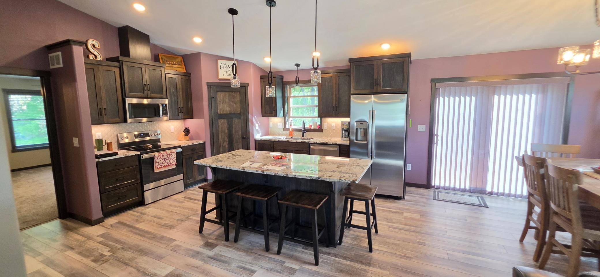 Large center island with granite top will accommodate most meals!
