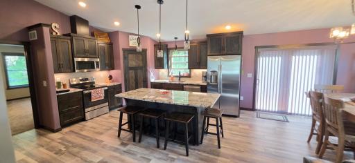 Large center island with granite top will accommodate most meals!