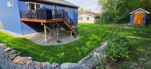 Large deck with quiet and peaceful backyard. Raspberry bushes as well!