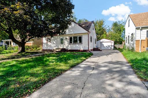 Beautiful mature shade tree in the front yard, adding charm and curb appeal.