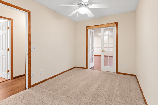 Lower level bedroom. Virtually enhanced. Furniture and personal belongings removed.