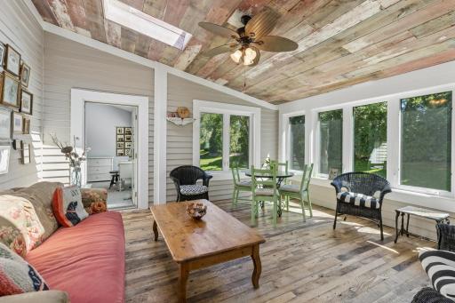 Charming three season porch with skylights and ceiling fan â enjoy the outdoors in comfort year-round.