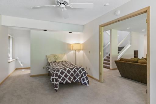 A serene bedroom retreat, thoughtfully designed for rest and relaxation - on of two bedrooms in lower level.