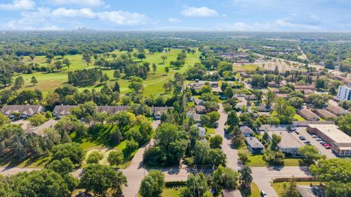 Stunning aerial views showcase the property's premier location â surrounded by lush green space, backing directly to the golf course, and just minutes from shopping, restaurants, and more.