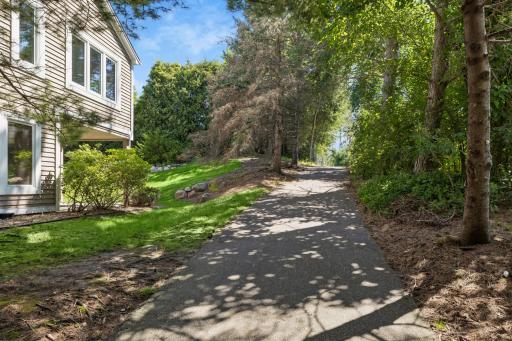 A peaceful, tree-lined path invites you to slow down and enjoy the beautifully wooded surroundings and walk to the golf course.