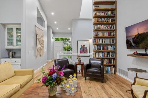 A cozy spot in the living room with built-in shelving â dream reading corner for the book lover in you!