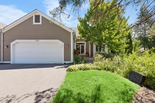 Welcome to this sought-after corner townhome backing directly onto the golf course, with private, tree-lined views right outside your door.