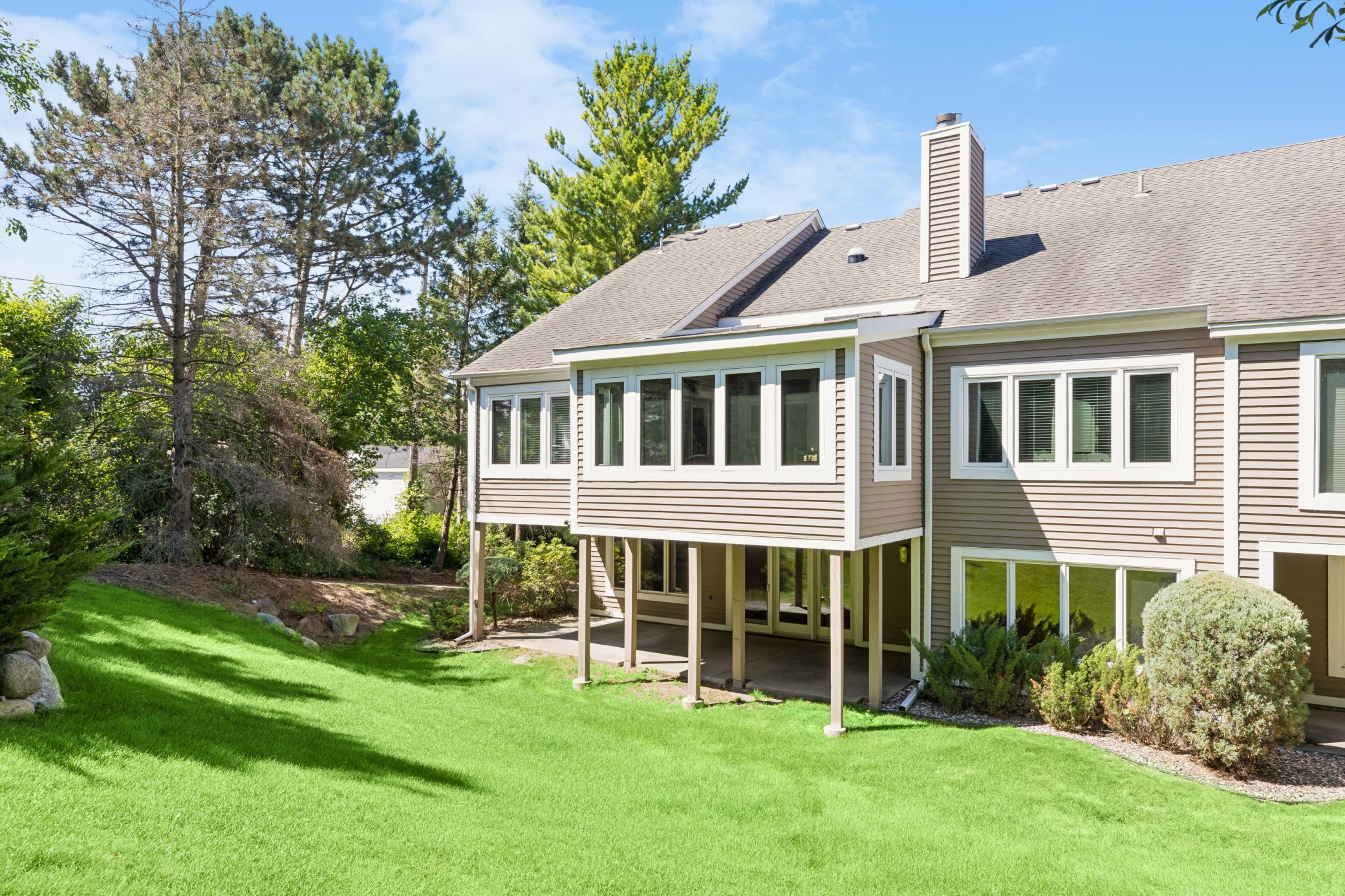 The back of the home is just as impressive — spacious patio perfect for entertaining or quiet mornings outdoors.