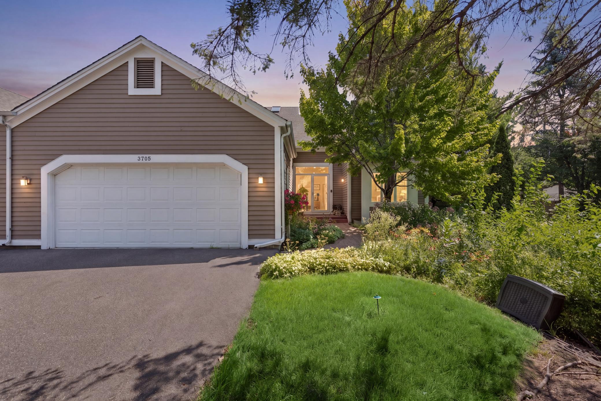 This sought-after corner townhome backs up directly to the golf course, with private, tree-lined views right outside your door.