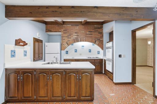 Custom kitchen with unique designs, built in double-oven