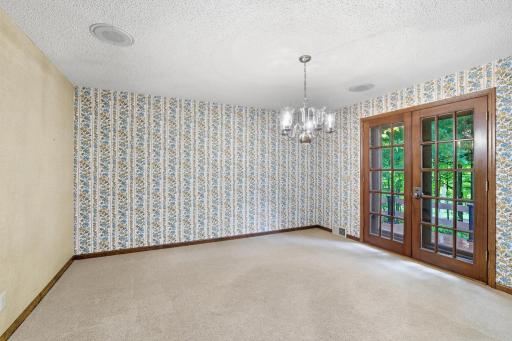 Formal dining room with newly built deck out the French doors.