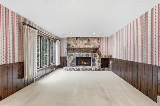 Lower level living room with second wood burning fireplace