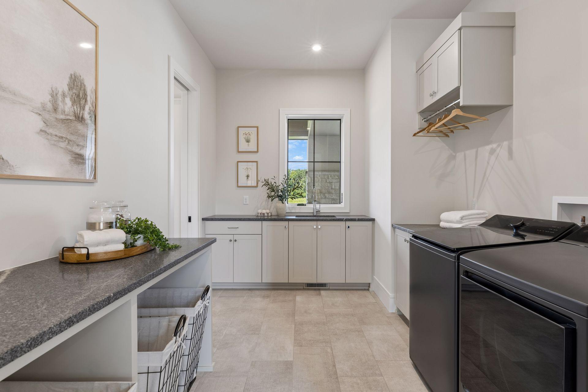 Main floor laundry room with plenty of work space