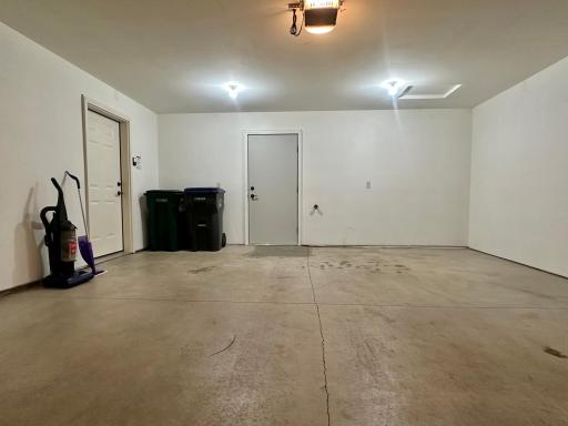 Utilities including furnace are in the room behind the door in back. Leave that door open and you have a heated garage to some degree. You even have a water supply to the right of the door.