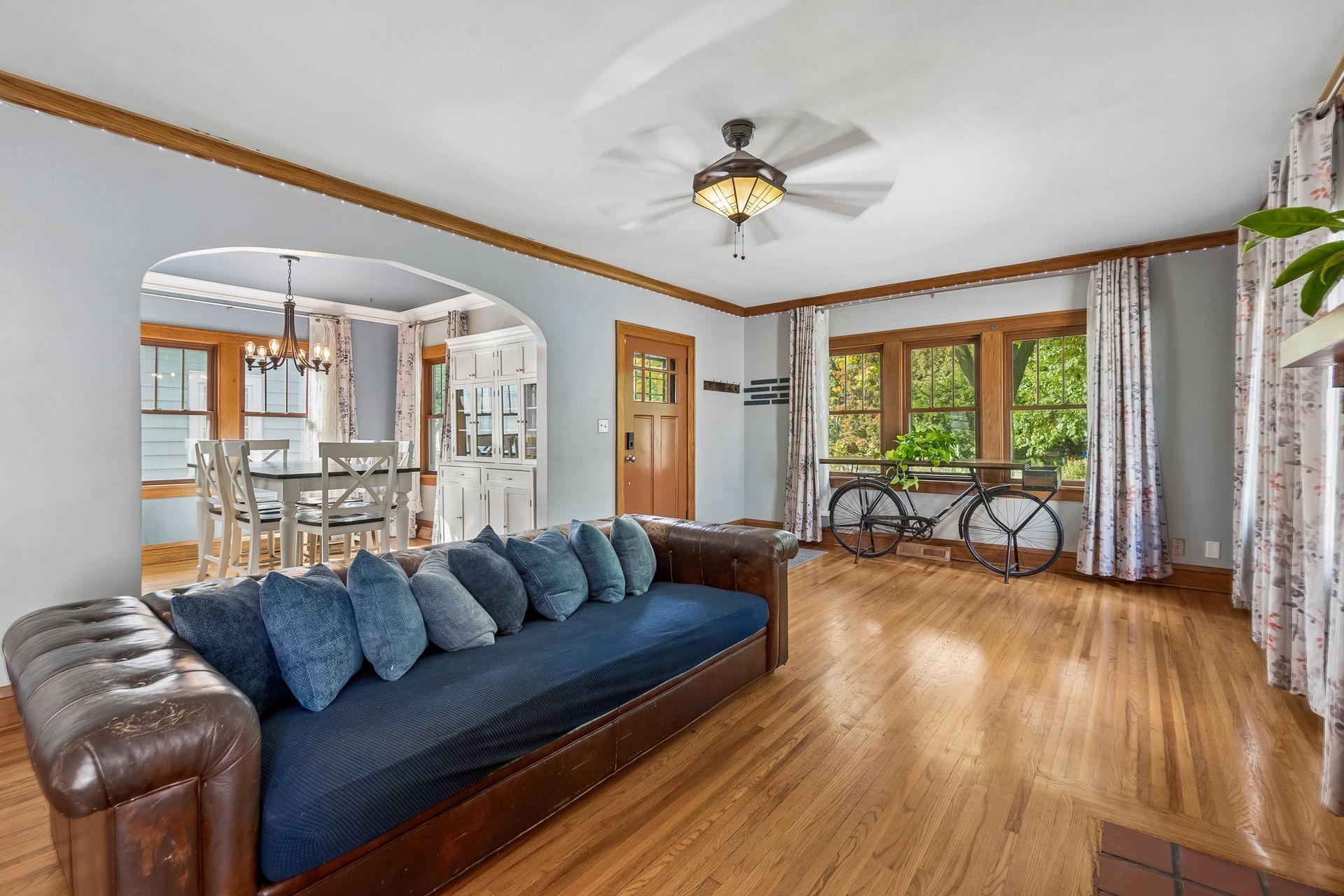 A graceful arched doorway connects the living room to the dining room, giving the main level an easy, open flow while keeping each space defined.