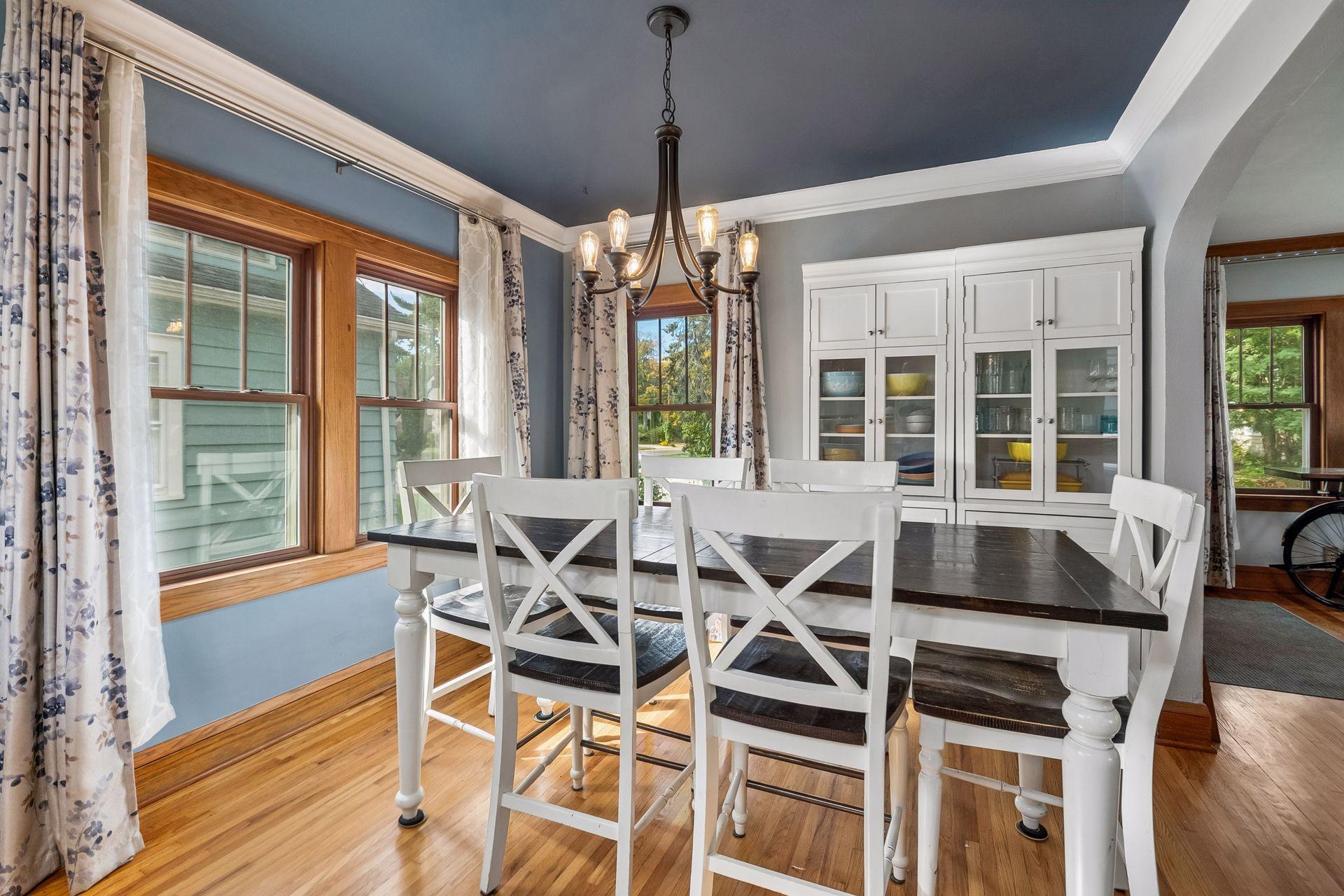 Big windows and hardwood floors make the dining room inviting for everyday meals and holiday gatherings alike.
