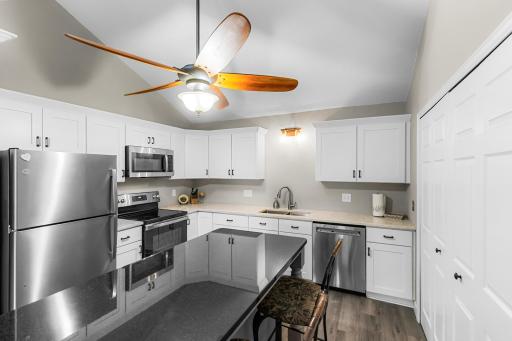 Photo for 3290 Greenbrier Street, 3290C, Vadnais Heights, MN 55127 - listing #7149522 This is your kitchen! Stainless steel appliances, granite breakfast bar, Upgraded white wood cabinets with plenty of counterspace for cooking & entertaining!