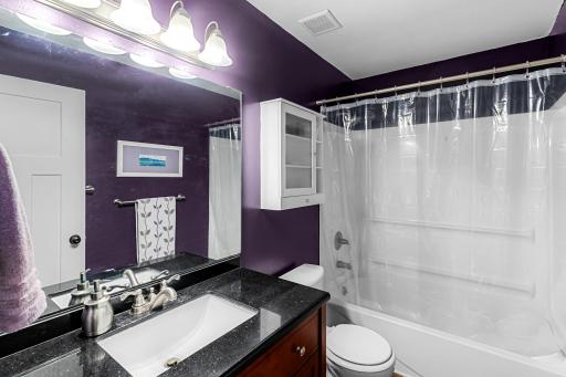 Granite vanity top, new lighting. Efficient fan.