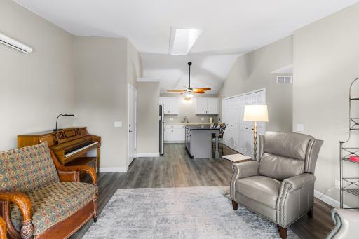 Spacious living room with wide wood baseboard. Professionally removed popcorn ceilings. Skylight and patio door for lots of natural light. Laminated floors throughout. Neutral colors repainted in last 2 years.
