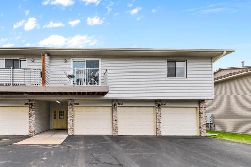 Semi-private deck with open sky for star-gazing, yet trees across the street. Single garage (far right) with high storage shelves and small workbench. Room for additional parking of 2 cars in driveway.