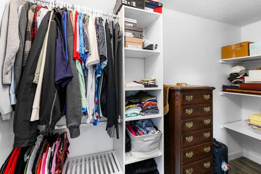 Primary bedroom storage with sturdy shelving. Plenty of floorspace too.