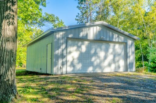 Pole barn/garage has concrete floor and room to store all those toys!