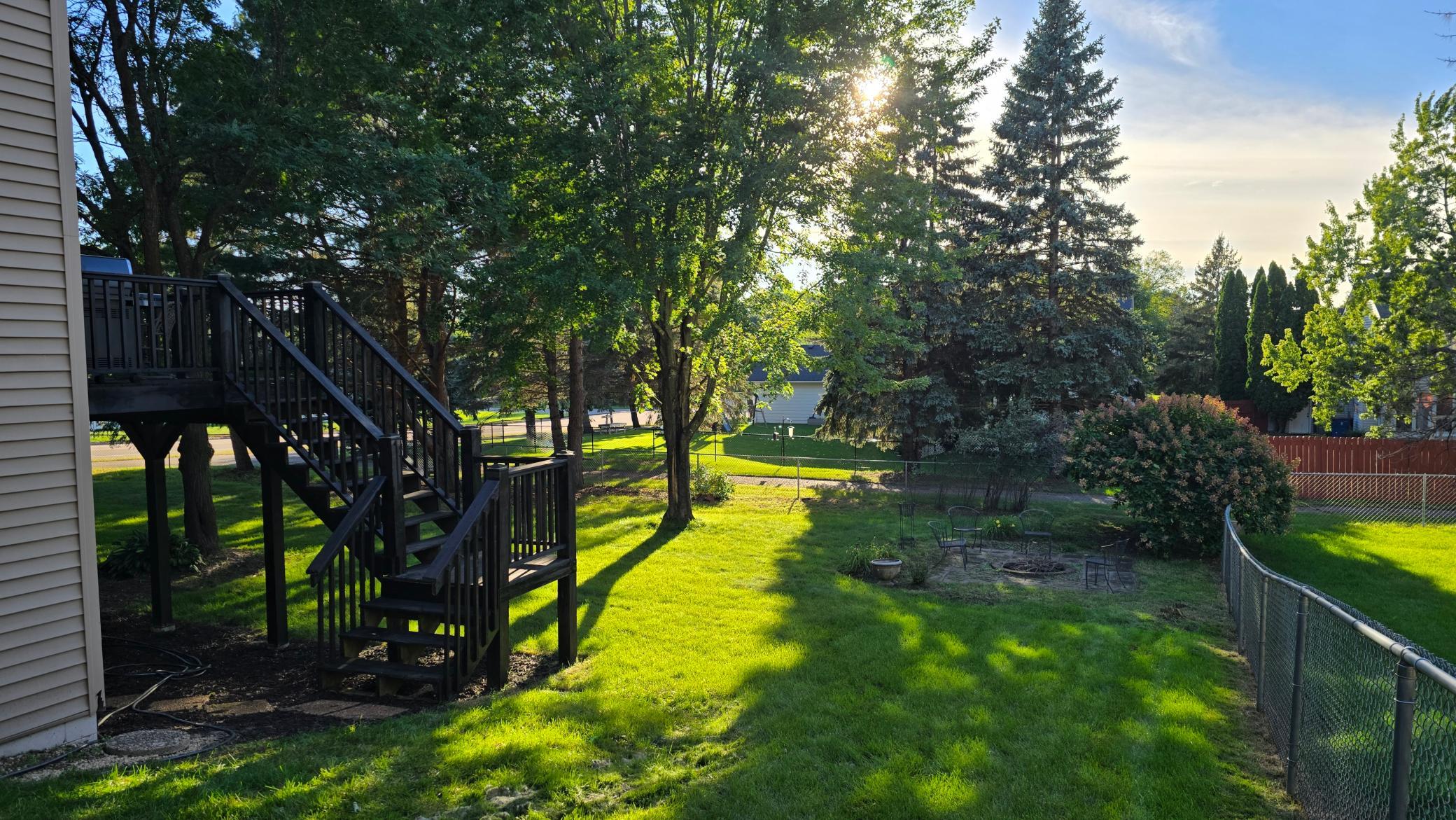 Beautiful yard - sits on .36 of an acre - fenced - deck with stairs down to yard.
