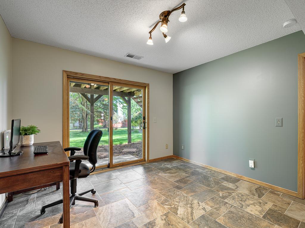 Flex area with in-floor heat and it's a walkout. Could be an office, exercise area or craft area....