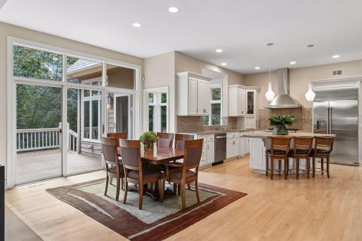 Informal dining area opens directly to the deck for easy indoor-outdoor dining and entertaining.