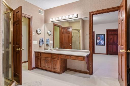 Full pass-through bath with separate shower, large vanity and water closet.