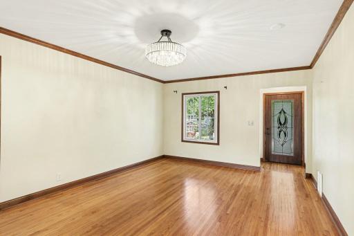 New crown molding, trim and pristine hardwood floors throughout the large main floor living room!