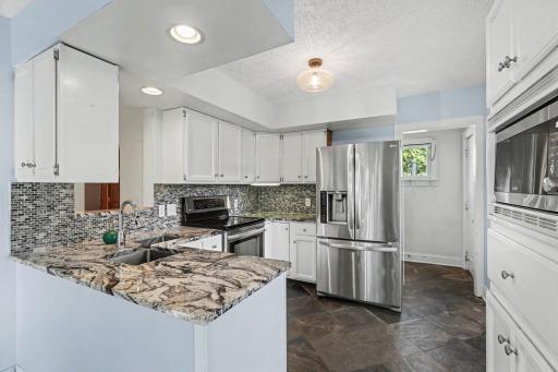 Huge kitchen with granite countertops and stainless steel appliances