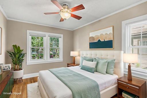 Spacious primary bedroom with plenty of natural light