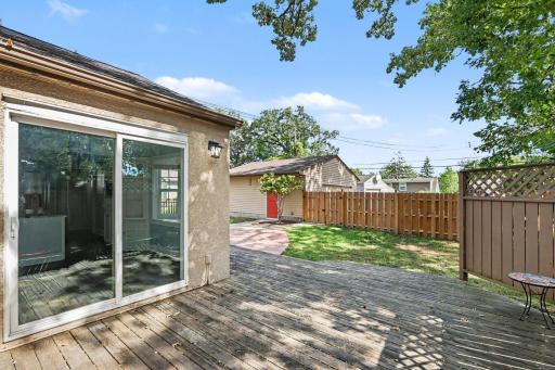 A total dream backyard with deck located off sliding glass door off dining room