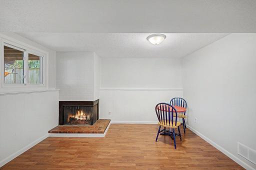 Open space off of family room in lower level. Fireplace is for chimney is closed off.