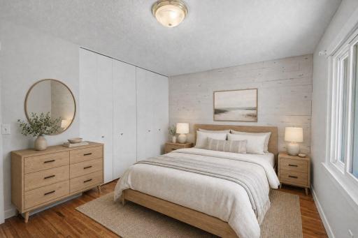 Primary bedroom offers double closet and the hardwood floors continue into both bedrooms. Virtually Stage