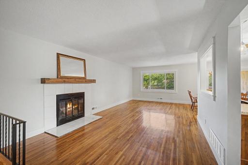 Living room has a wood burning fireplace