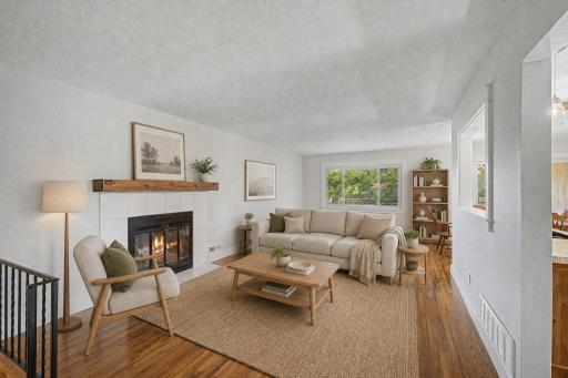 The living room is spacious and open for great entertaining. Beautiful hard wood floor through out the main level