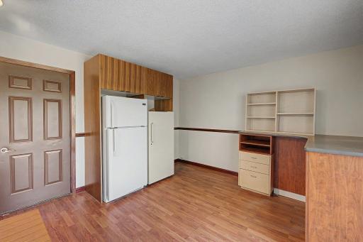 Bonus space for your needs. Freezer and refrigerator stay. Large closet to the side and a sliding glass door to reach the backyard
