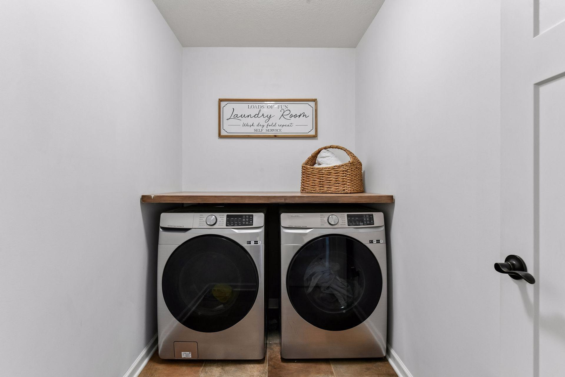 Convenient upper-level laundry room puts everyday chores right where you need them. Spacious and functional, with room for storage and folding, this thoughtfully located space adds ease and efficiency to daily living.