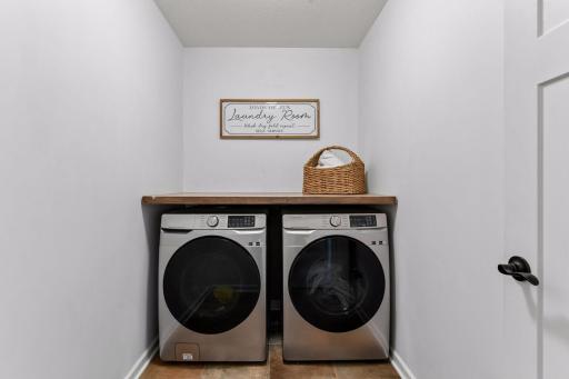 Convenient upper-level laundry room puts everyday chores right where you need them. Spacious and functional, with room for storage and folding, this thoughtfully located space adds ease and efficiency to daily living.