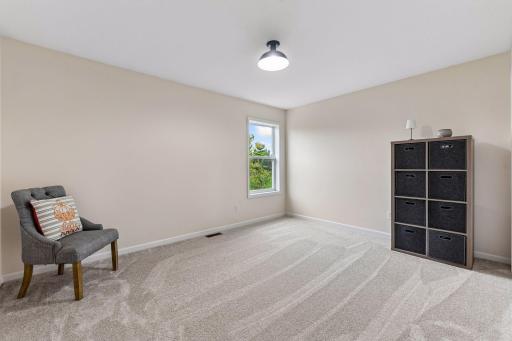 Bedroom 4 in upper level with private view of backyard. All spacious bedrooms with large close space.