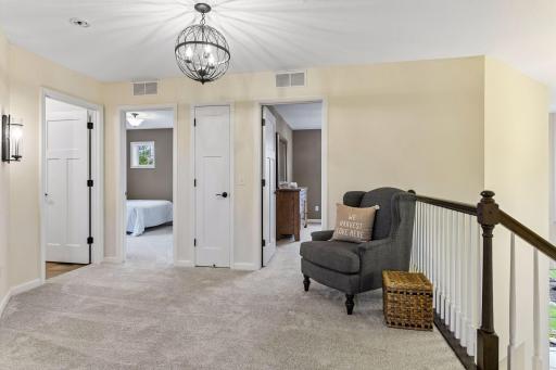 Versatile upper-level loft offers the perfect flex space for a media room, play area or homework station. Open to the foyer below, this bright and spacious retreat adds extra living space to fit your lifestyle.